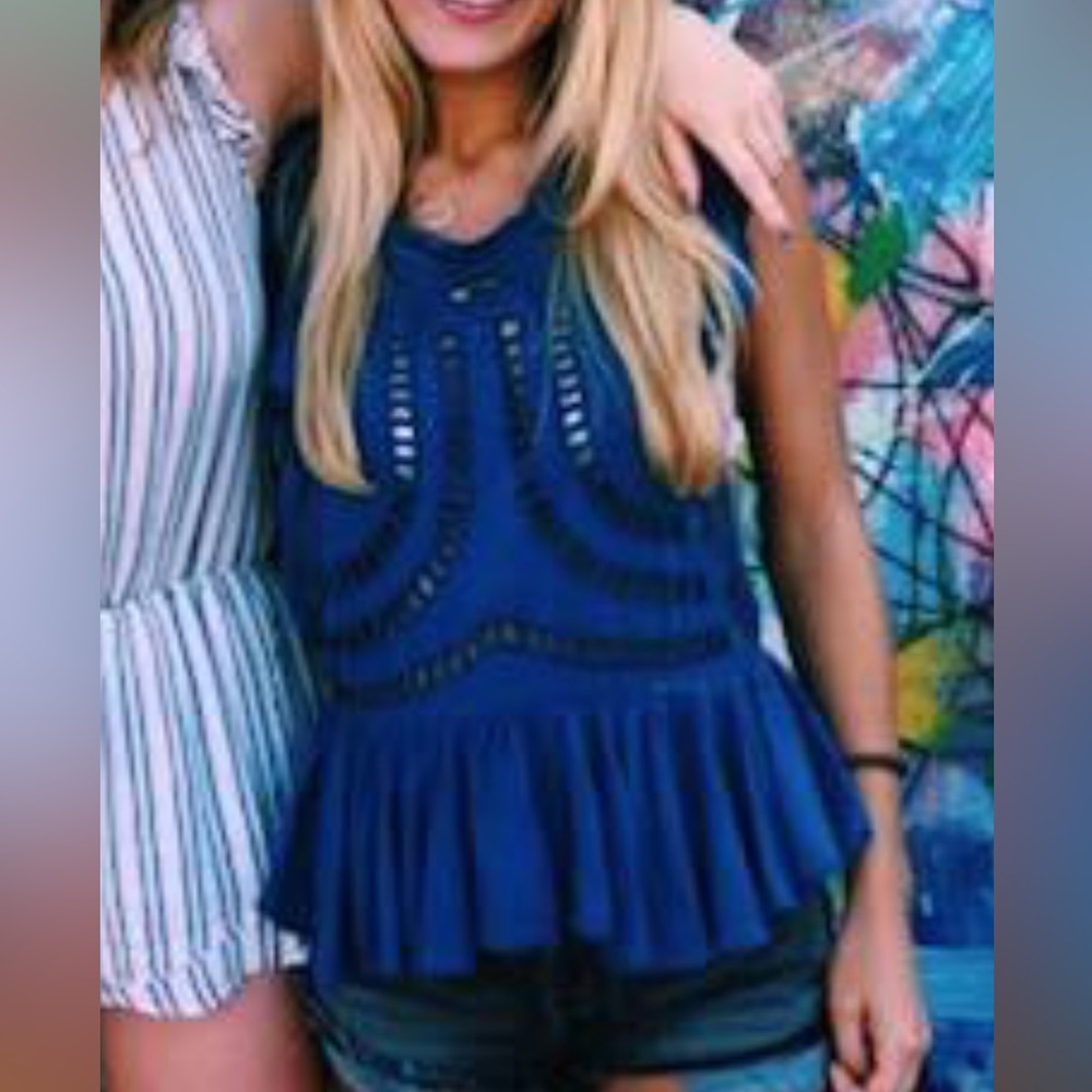Free people blue cut out embroidered top